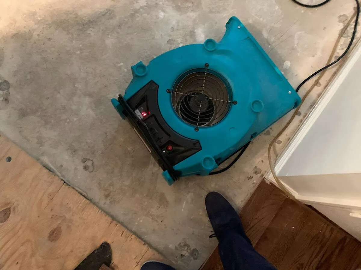 Air mover drying subfloor during Commercial Water Damage Restoration in Difficult Run